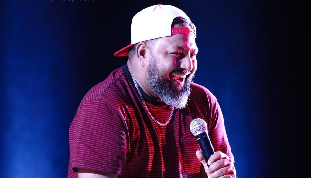 Sajan Shrestha performing stand-up comedy in Nepal with calm, observational humor